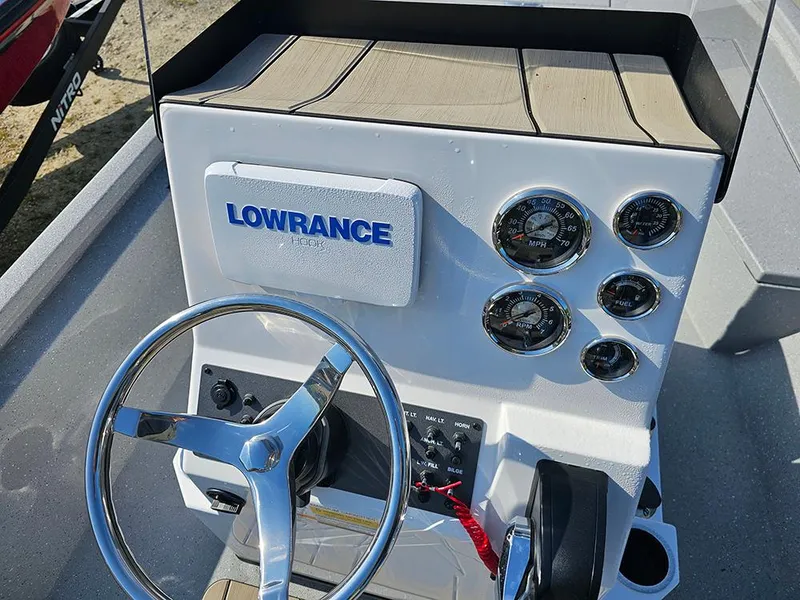 Slide: The Image of Steering console of 2025 Vexus ACX 2000 boat with Lowrance electronics and gauges. - 14