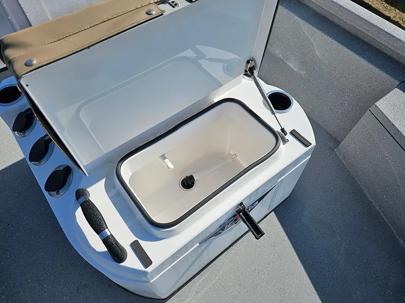 Slide: The Image of Open storage compartment on 2025 Vexus ACX 2000 boat, featuring multiple cup holders. - 17