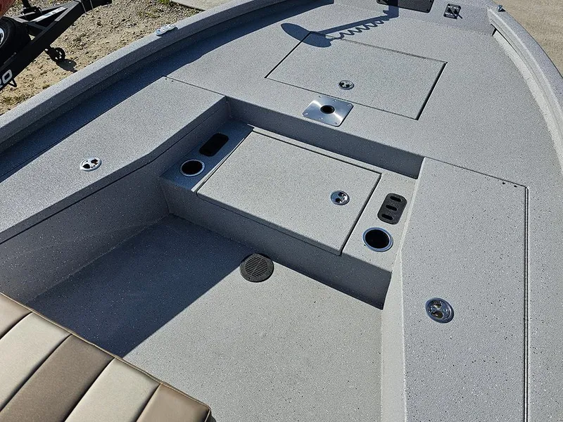 Slide: The Image of 2025 Vexus ACX 2000 boat interior with storage compartments and cup holders. - 19