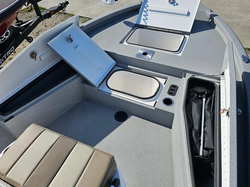 Slide: The Image of 2025 Vexus ACX 2000 boat interior with storage compartments and seating. - 20
