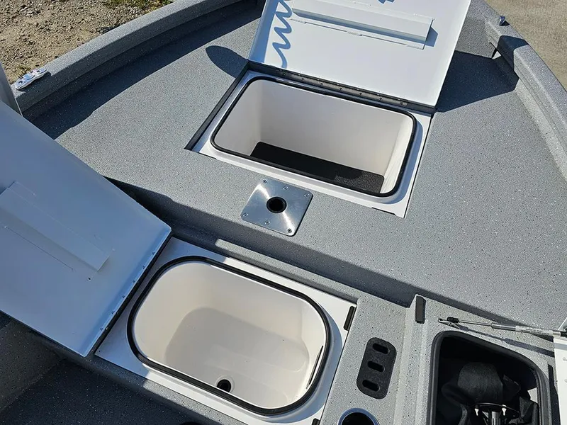 Slide: The Image of 2025 Vexus ACX 2000 boat storage compartments with open lids, showcasing interior design. - 21
