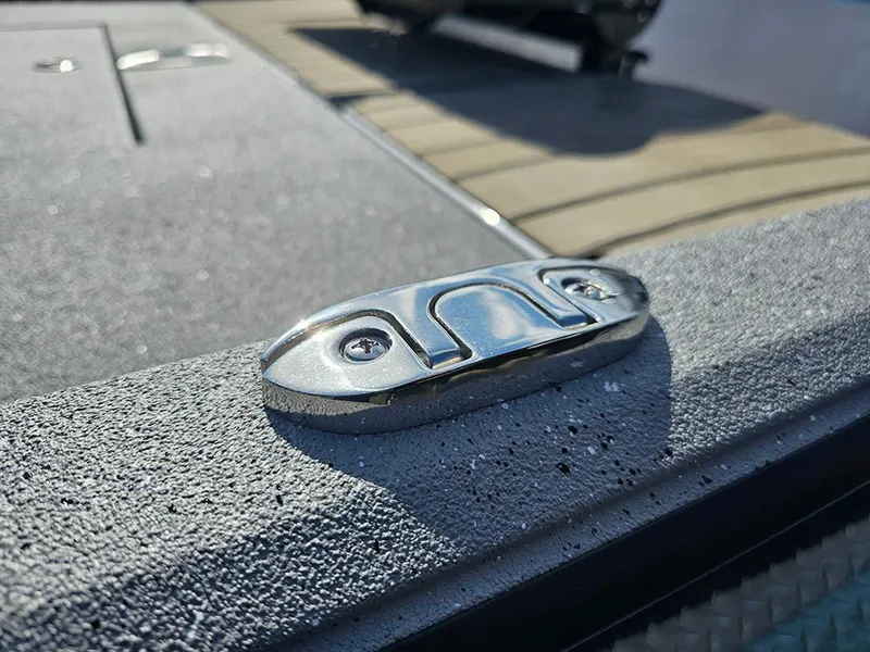 Slide: The Image of Close-up of a 2025 Vexus ACX 2000 boat cleat on textured surface. - 24
