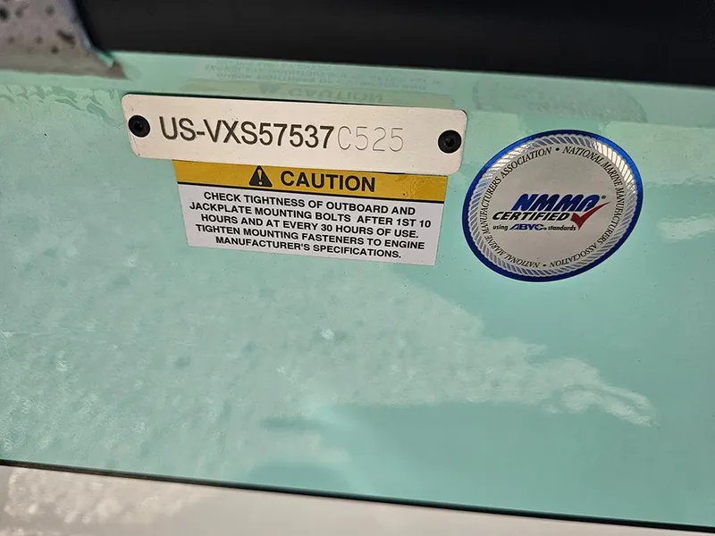Slide: The Image of Boat warning label on Vexus ACX 2000, 2025 model, with NMMA certification sticker. - 26
