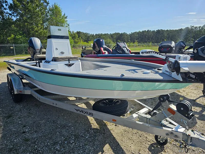 Slide: The Image of 2025 Vexus ACX 2000 boat on trailer, parked outdoors, sunny day. - 4