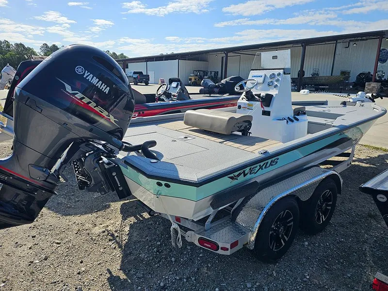 Slide: The Image of 2025 Vexus ACX 2000 boat with Yamaha motor, parked outdoors on a trailer. - 5