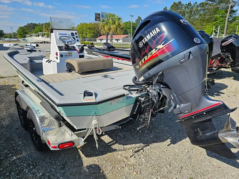 Slide: The Image of 2025 Vexus ACX 2000 boat with Yamaha outboard motor on a trailer. - 7