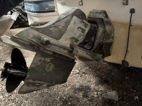 Slide: The Image of 2006 Glastron MX 195 boat propeller and outdrive, showing wear and corrosion. - 1