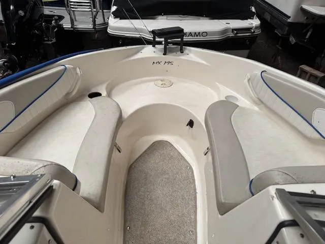 Slide: The Image of 2006 Glastron MX 195 boat interior with seating and storage compartments. - 3