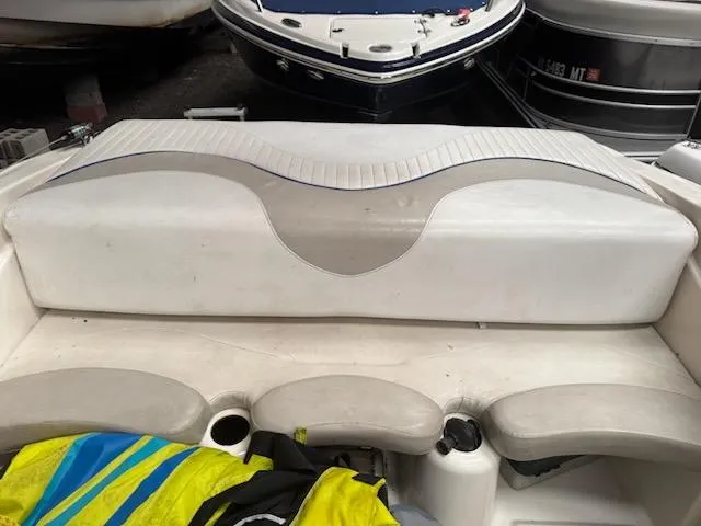 Slide: The Image of 2006 Glastron MX 195 boat interior seating with colorful life jackets. - 4