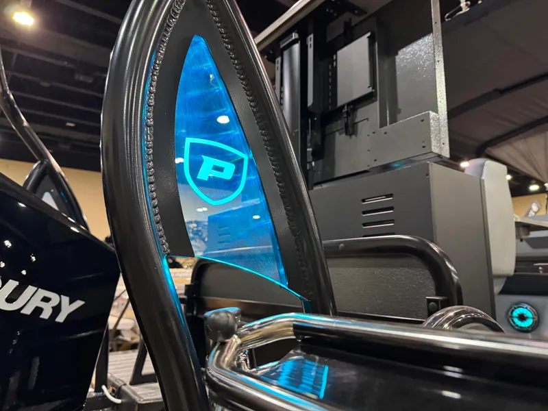 Slide: The Image of 2025 Premier 250 Solaris Rear Social boat with illuminated blue logo detail. - 15