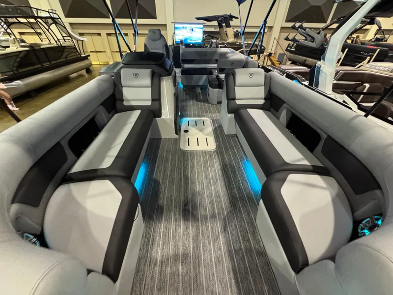 Slide: The Image of 2025 Premier 250 Solaris Rear Social pontoon boat with spacious seating and modern interior design. - 19