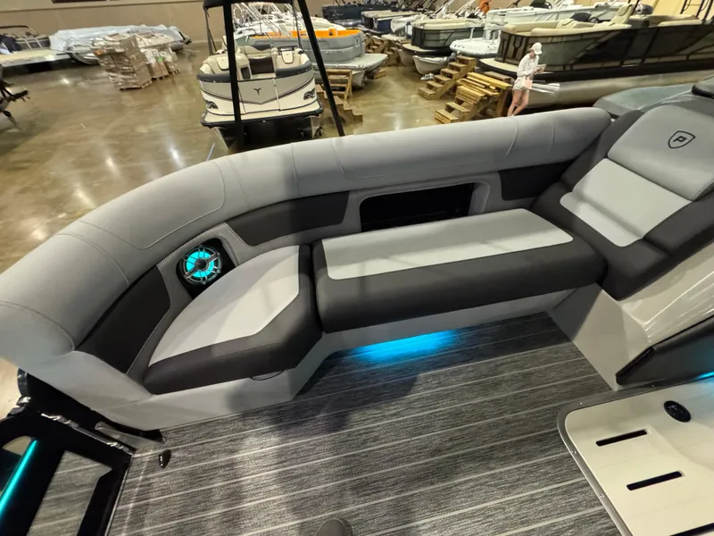 Slide: The Image of 2025 Premier 250 Solaris Rear Social boat interior with sleek seating and ambient lighting. - 21