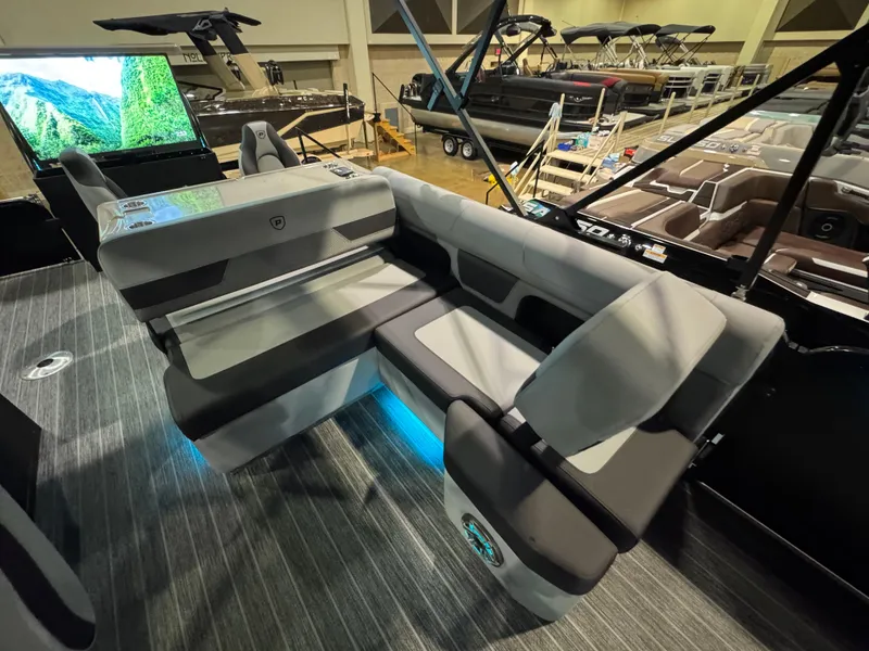 Slide: The Image of 2025 Premier 250 Solaris Rear Social boat interior with modern seating and ambient lighting. - 26
