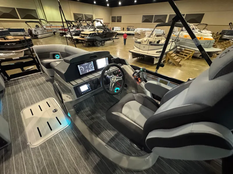 Slide: The Image of Luxurious 2025 Premier 250 Solaris Rear Social boat interior at a showroom display. - 27