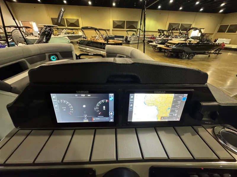Slide: The Image of Control panel of 2025 Premier 250 Solaris Rear Social boat with dual Simrad displays. - 28