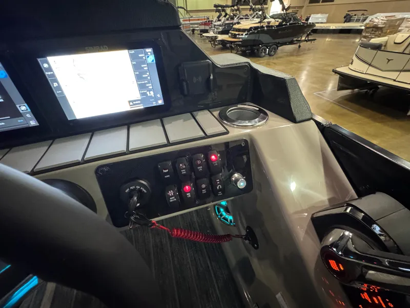 Slide: The Image of Control panel of 2025 Premier 250 Solaris Rear Social boat with navigation display. - 29
