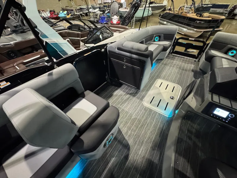 Slide: The Image of Luxurious 2025 Premier 250 Solaris Rear Social pontoon boat interior with modern seating and ambient lighting. - 34