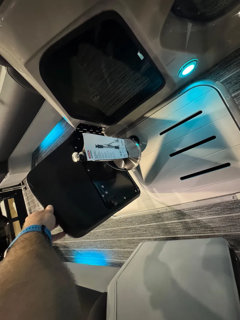 Slide: The Image of 2025 Premier 250 Solaris Rear Social boat interior with modern lighting and seating. - 35