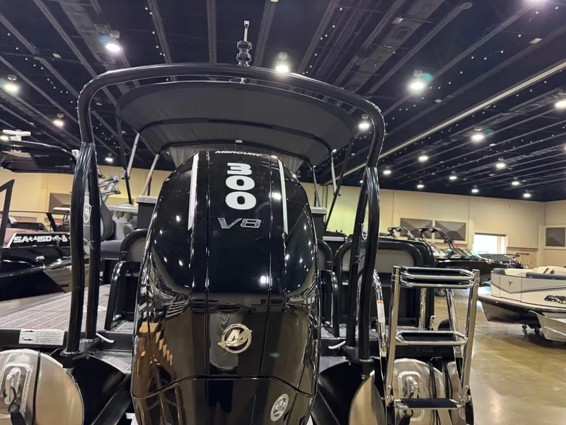 Slide: The Image of 2025 Premier 250 Solaris Rear Social boat with 300 V8 engine displayed indoors. - 44