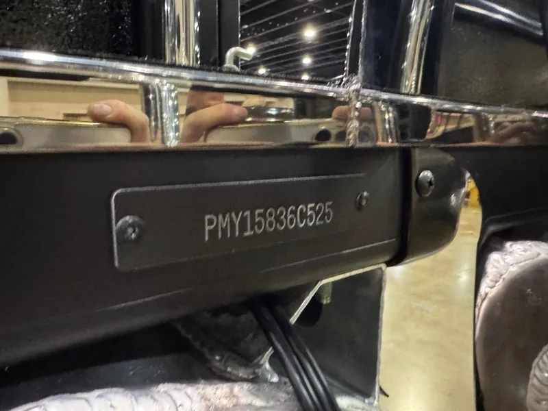 Slide: The Image of 2025 Premier 250 Solaris Rear Social boat with visible serial number plate indoors. - 45