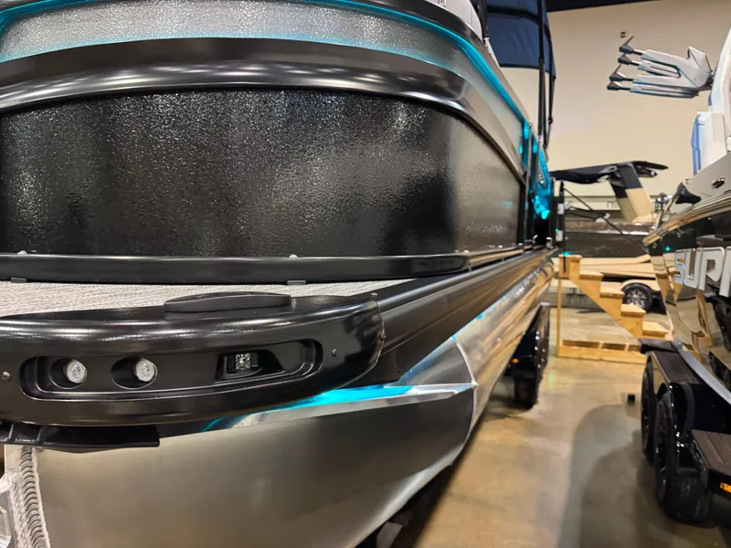 Slide: The Image of 2025 Premier 250 Solaris Rear Social pontoon boat, sleek design, indoor display. - 6