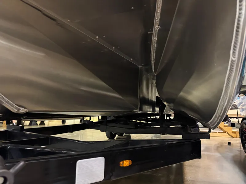 Slide: The Image of Underneath view of 2025 Premier 250 Solaris Rear Social pontoon boat on trailer. - 8