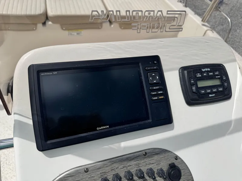Slide: The Image of 2019 Carolina Skiff 218 DLV dashboard with Garmin navigation system. - 13