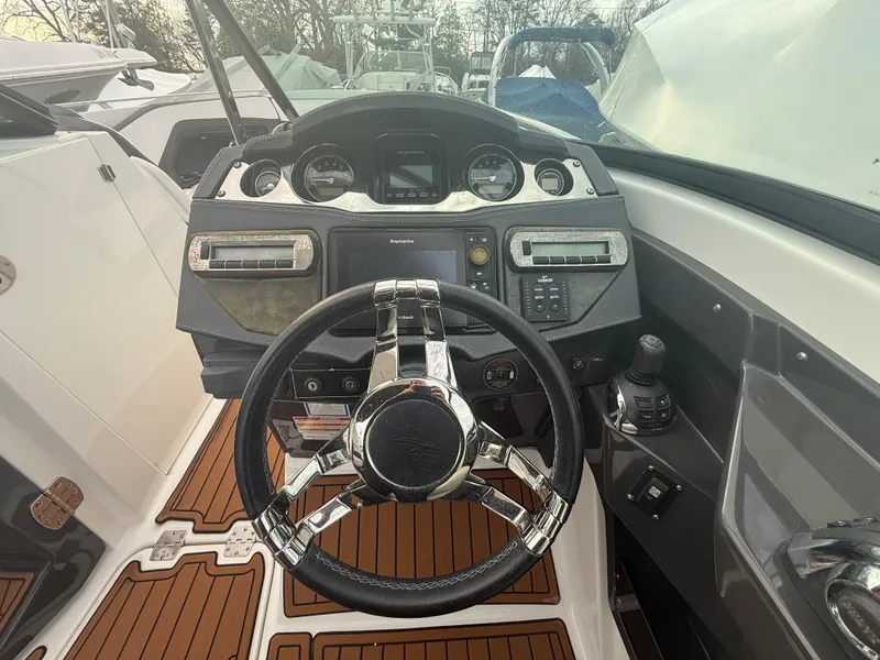 Slide: The Image of 2018 Monterey 298 Super Sport dashboard with steering wheel and control panel. - 13