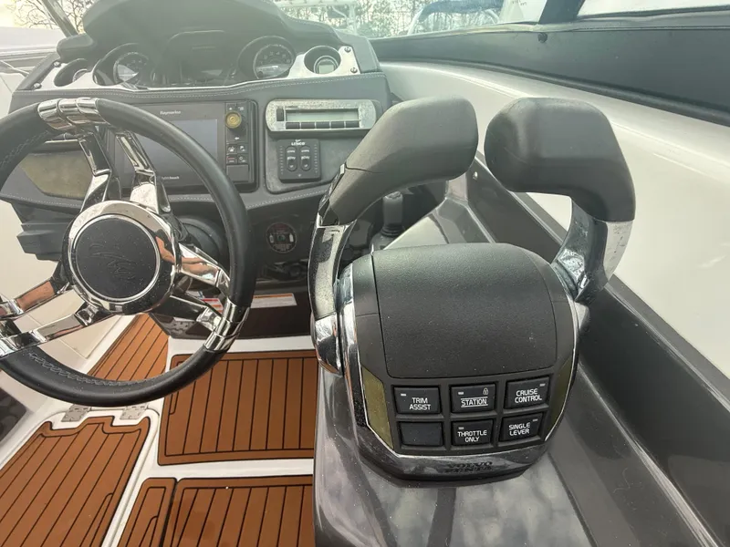 Slide: The Image of 2018 Monterey 298 Super Sport boat cockpit with steering wheel and control panel. - 15