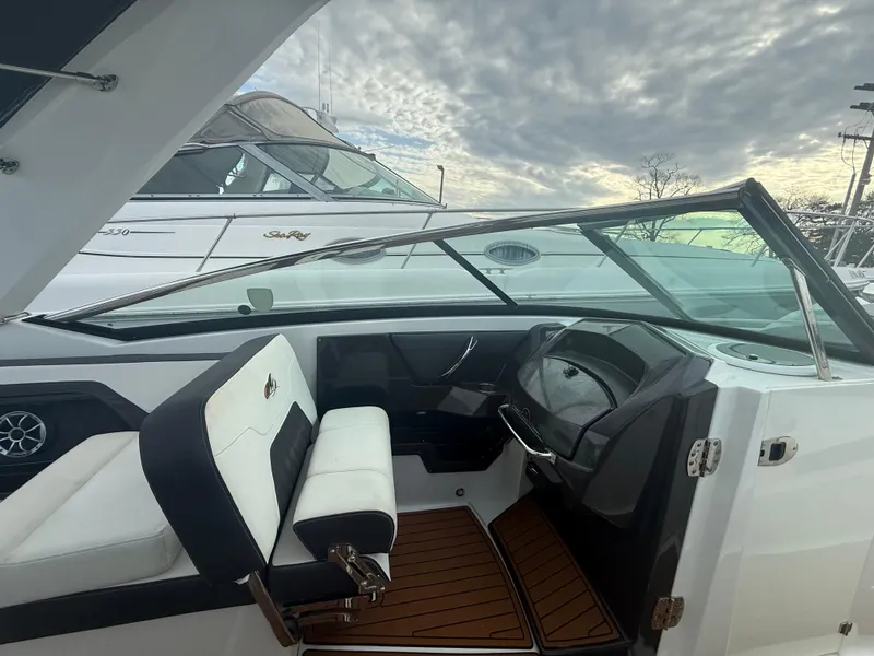 Slide: The Image of 2018 Monterey 298 Super Sport boat interior with sleek design and modern dashboard. - 18