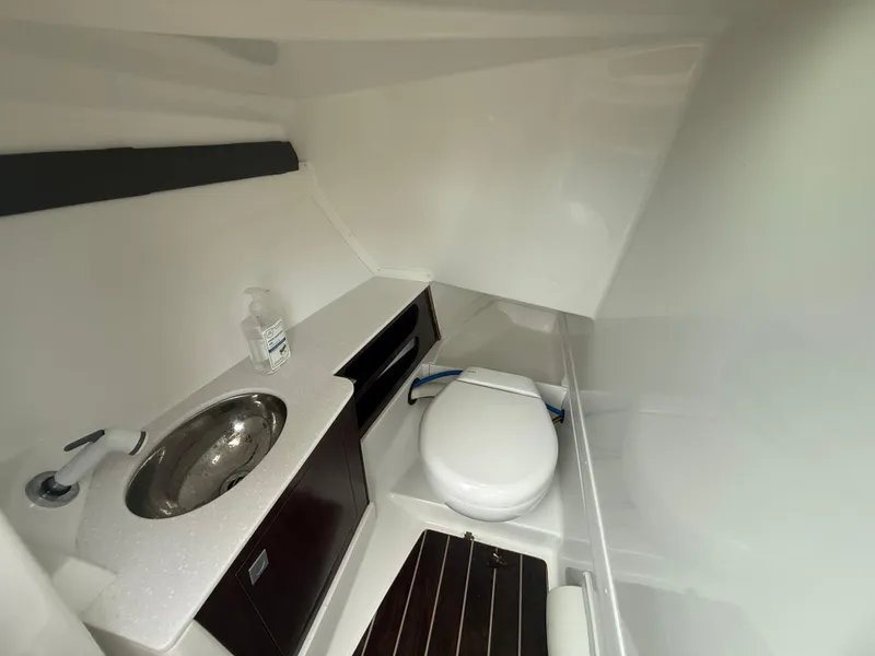 Slide: The Image of 2018 Monterey 298 Super Sport boat bathroom with sink and toilet. - 19