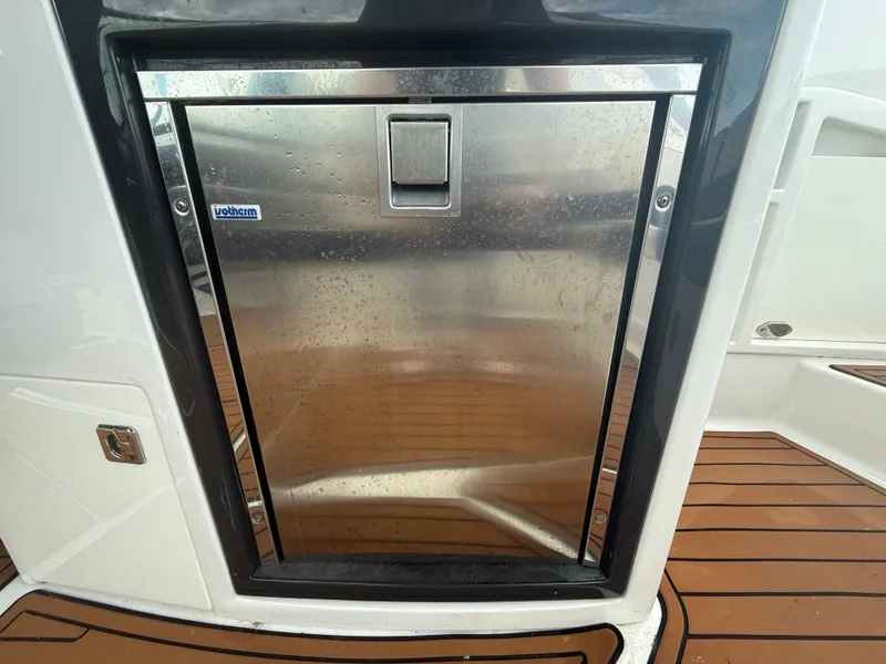 Slide: The Image of Stainless steel refrigerator on 2018 Monterey 298 Super Sport boat deck. - 22