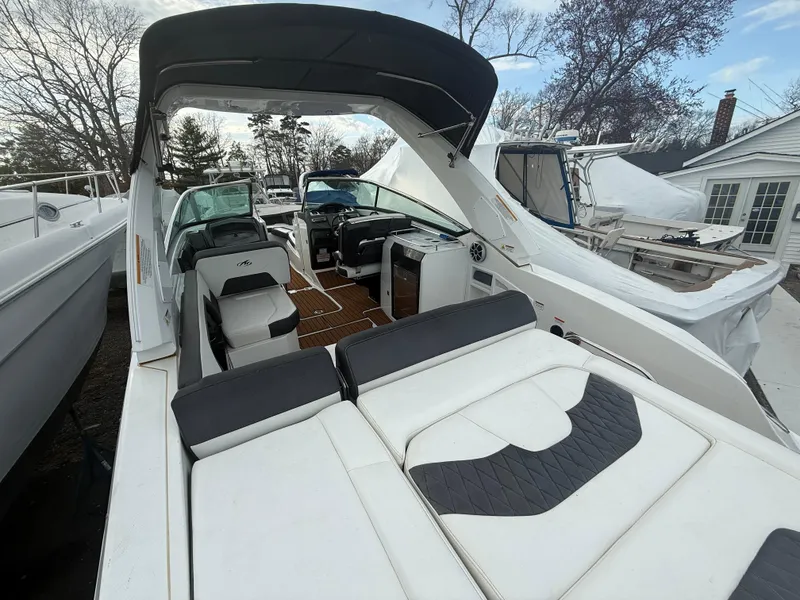 Slide: The Image of 2018 Monterey 298 Super Sport boat with spacious seating and sleek design. - 29