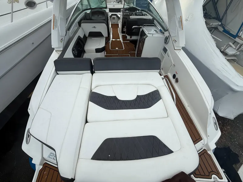 Slide: The Image of 2018 Monterey 298 Super Sport boat with luxurious seating and sleek interior design. - 31