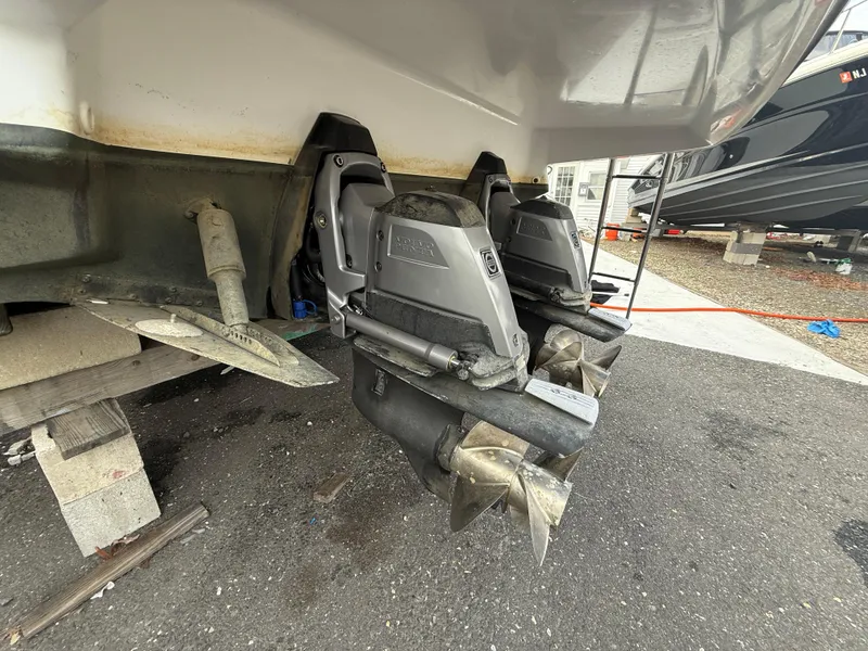 Slide: The Image of 2018 Monterey 298 Super Sport boat with dual outboard motors on a trailer. - 32