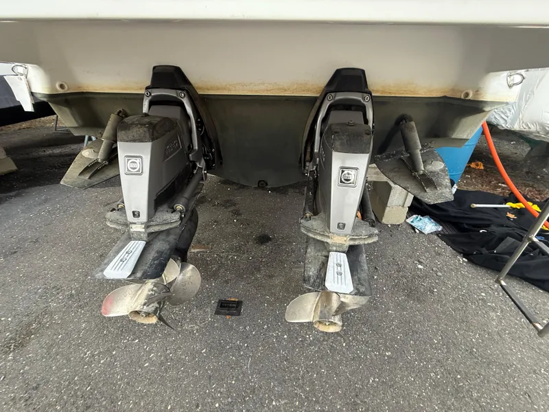 Slide: The Image of 2018 Monterey 298 Super Sport boat with dual outboard motors on a trailer. - 33
