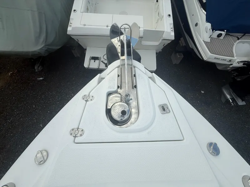 Slide: The Image of 2018 Monterey 298 Super Sport boat anchor system, top view, on gravel surface. - 6