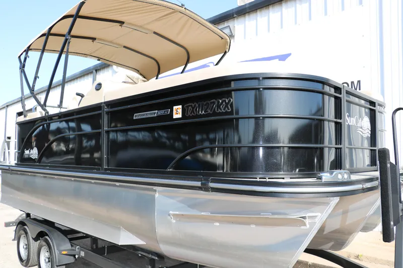 Slide: The Image of 2024 SunCatcher Select 320 RC pontoon boat with canopy on trailer, side view. - 11