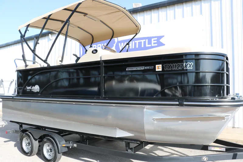 Slide: The Image of 2024 SunCatcher Select 320 RC pontoon boat with canopy on trailer, side view. - 12