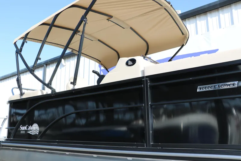 Slide: The Image of 2024 SunCatcher Select 320 RC pontoon boat with canopy, side view. - 18