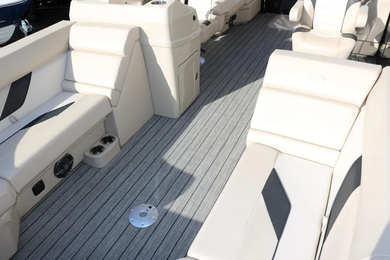 Slide: The Image of 2024 SunCatcher Select 320 RC boat interior with plush seating and modern design. - 22
