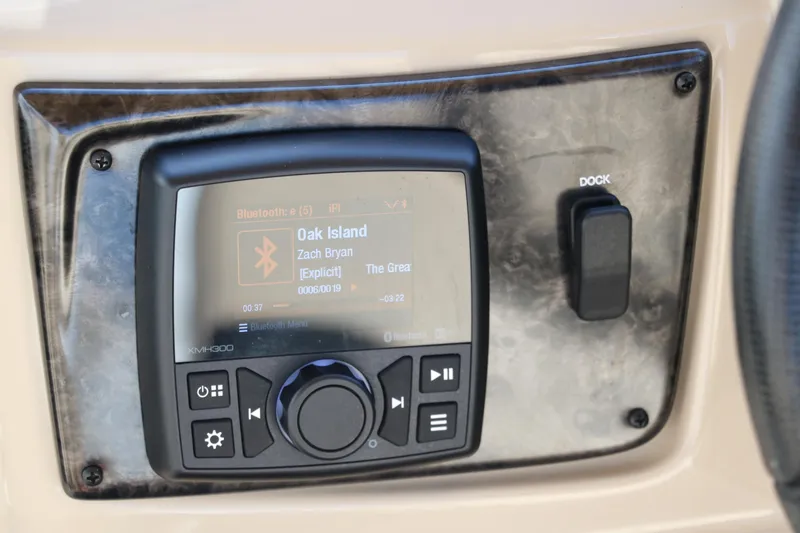 Slide: The Image of 2024 SunCatcher Select 320 RC audio system with display showing song details. - 30