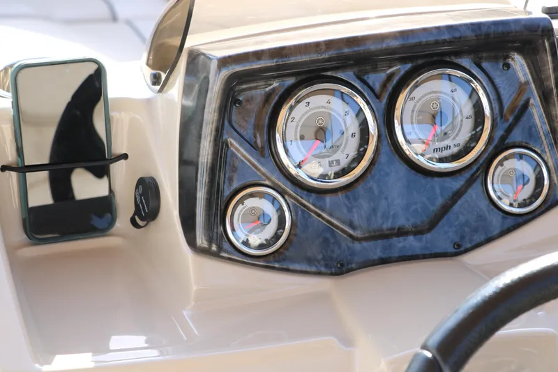 Slide: The Image of Dashboard of 2024 SunCatcher Select 320 RC boat with gauges and smartphone holder. - 31