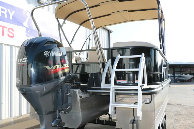 Slide: The Image of 2024 SunCatcher Select 320 RC pontoon boat with Yamaha outboard motor and ladder. - 4