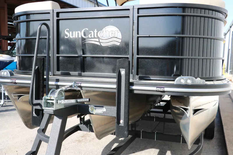 Slide: The Image of 2024 SunCatcher Select 320 RC pontoon boat, black exterior, front view. - 8