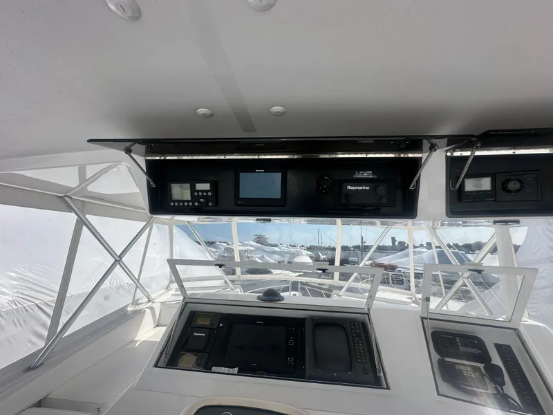 Slide: The Image of 1998 Viking 53 Convertible yacht cockpit with navigation equipment and panoramic windows. - 15