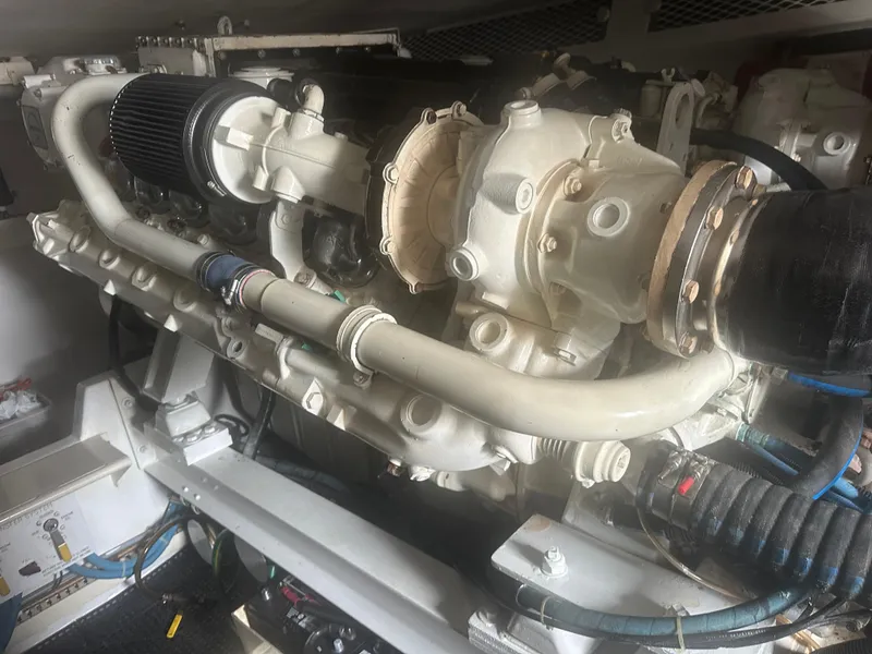 Slide: The Image of Engine of a 1998 Viking 53 Convertible boat, showcasing intricate mechanical components. - 40