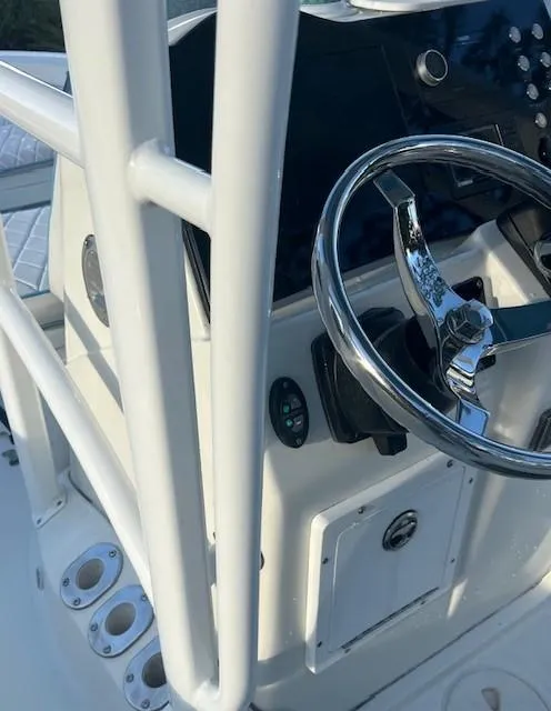 Slide: The Image of 2003 Hydra-Sports Bay Bolt 2300 boat console with steering wheel and controls. - 10