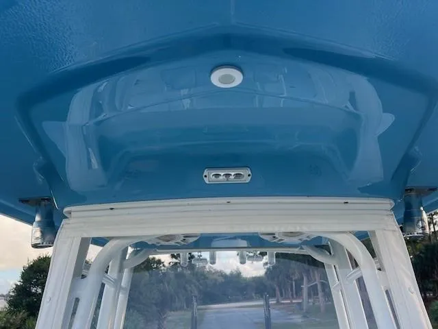 Slide: The Image of 2003 Hydra-Sports Bay Bolt 2300 boat canopy, featuring a sleek blue design. - 12
