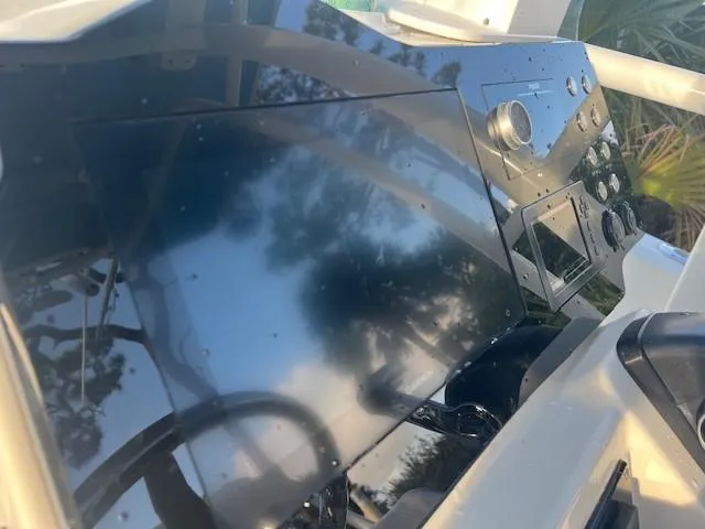 Slide: The Image of 2003 Hydra-Sports Bay Bolt 2300 dashboard with control panel and steering wheel. - 15